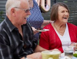 Group of elderly people enjoying afternoon tea at Retirement Home in Rotorua