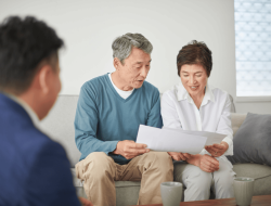 Karaka-Pines-team-member-providing-clear-information-to-a-resident