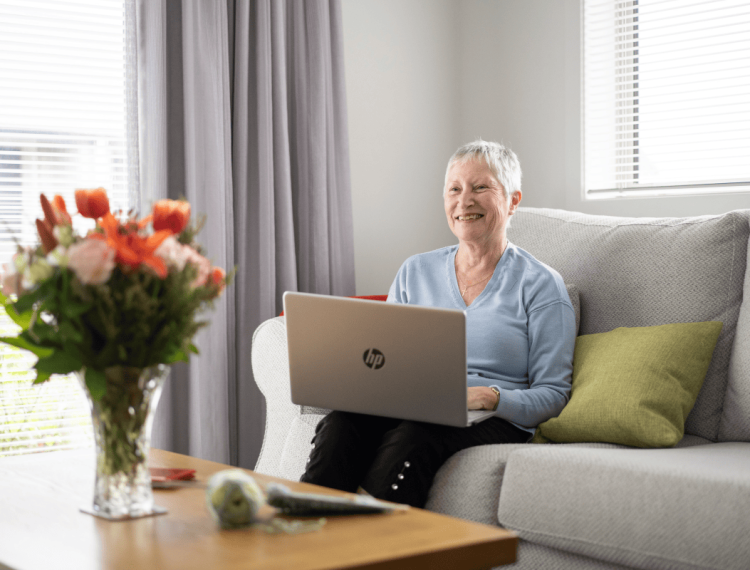 Older-lady-reviewing-home-plans-on-her-laptop-representing-financial-clarity